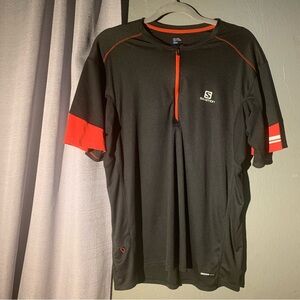 Salomon black and red lining activewear T-shirt with small pocket. Size XL/L.